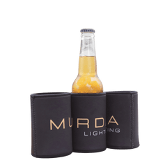 Three MURDA Lighting stubby coolers with a glass bottle, group shot showing full gold MURDA Lighting logo