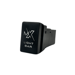 12V push switch with laser-etched MX Light Bar logo, front three-quarter view showing ON-OFF markings